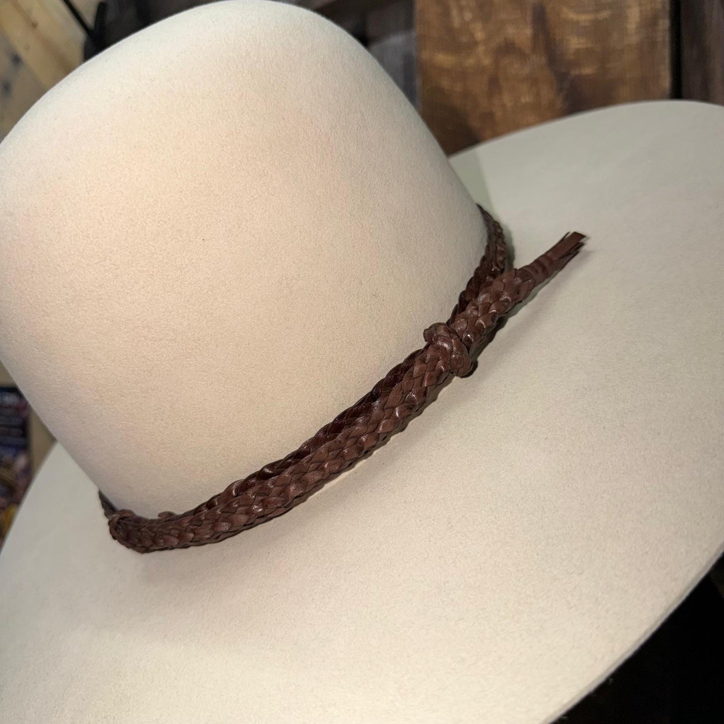 Brown braided necklace on a mannequin head