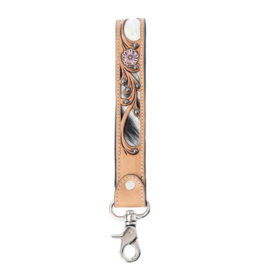 Decorative leather strap with floral design and metal clasp on a white background