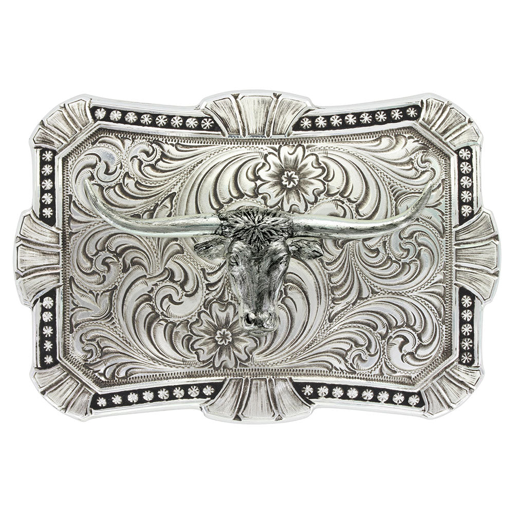 An ornate silver-toned belt buckle featuring a carved longhorn steer design with floral scrollwork and black oxidized detailing, shown on a plain white background.