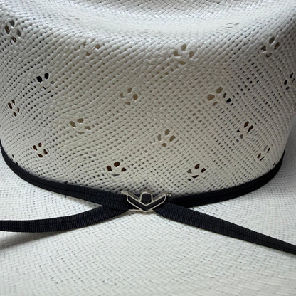 White straw hat with a black band and prohat black pin 