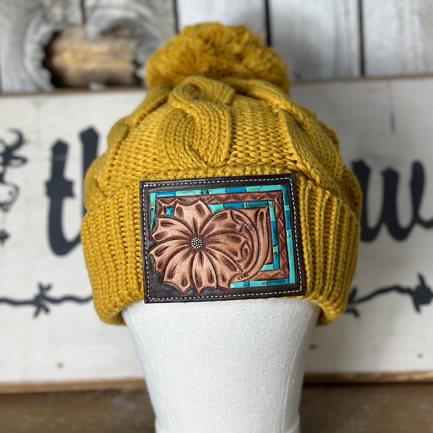 Amanda Rose Chunky Cable Knit Beanie w/ Pom and Hand Tooled Patch