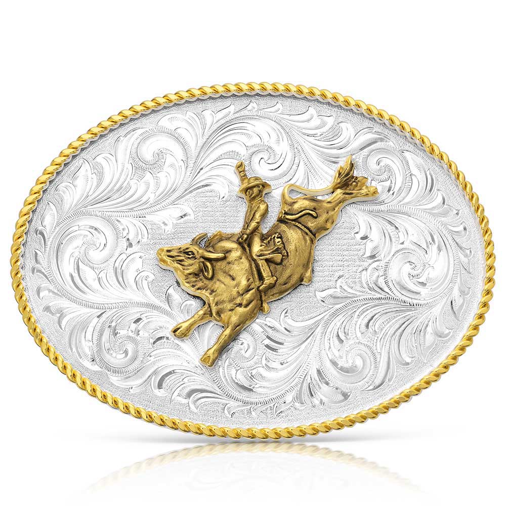 Belt buckle with gold bull and rider design on a silver background