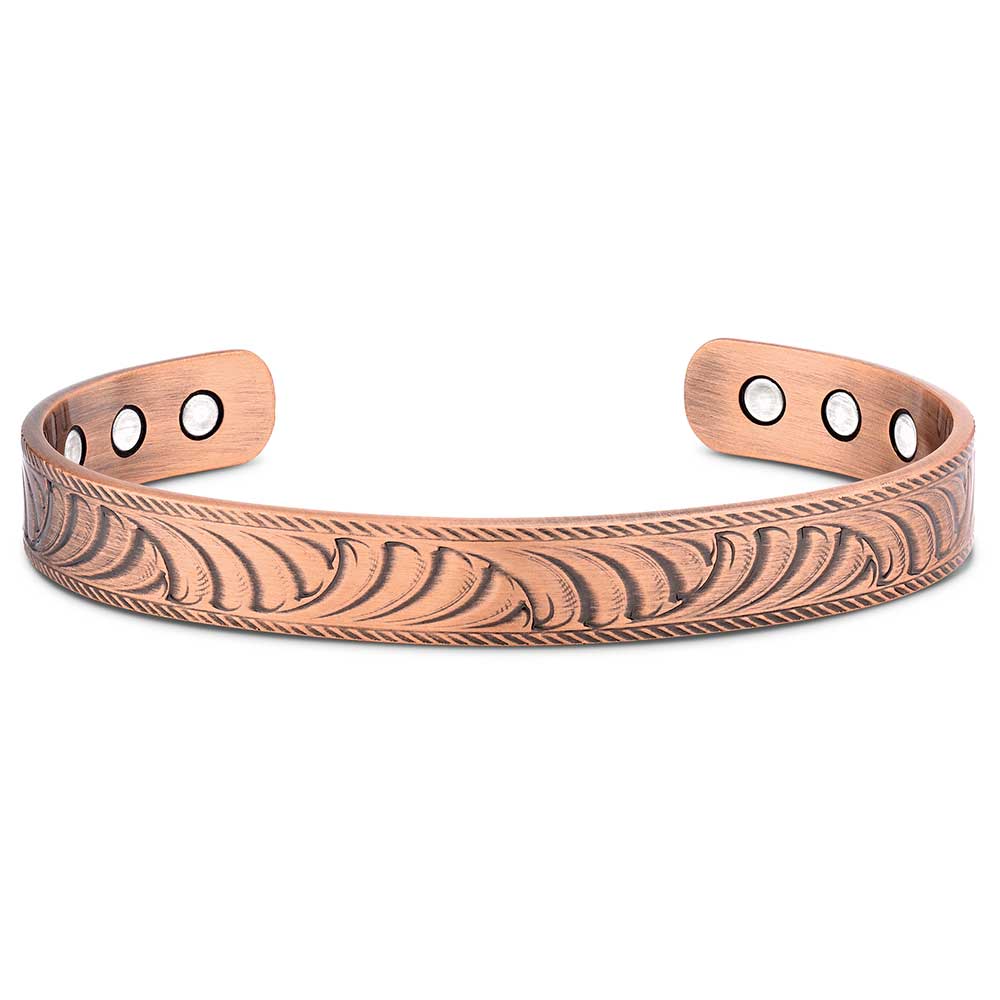 Copper bracelet with engraved design on a white background