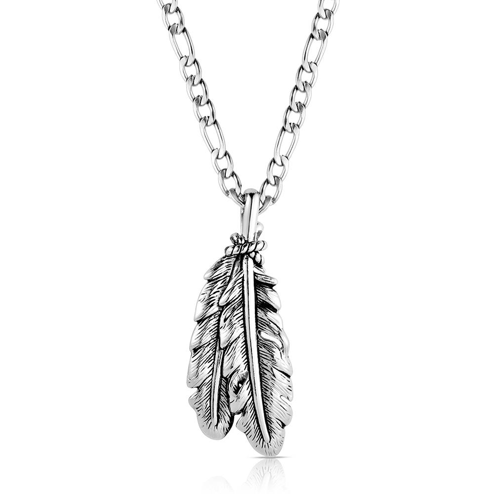 A silver-toned necklace featuring a detailed, textured feather pendant on a classic curb chain, shown against a plain white background.